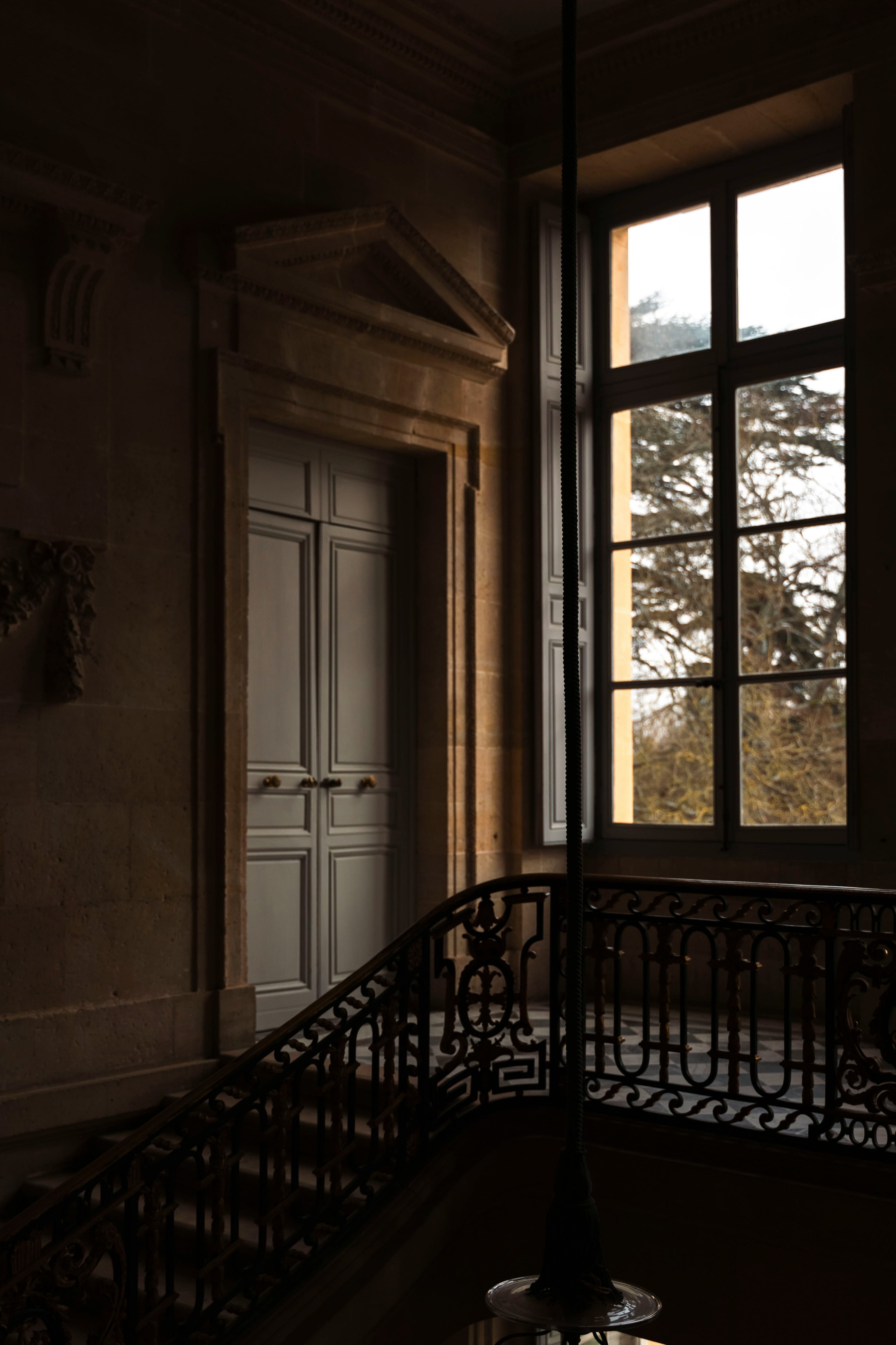 Natural light through a window in a stone interior.